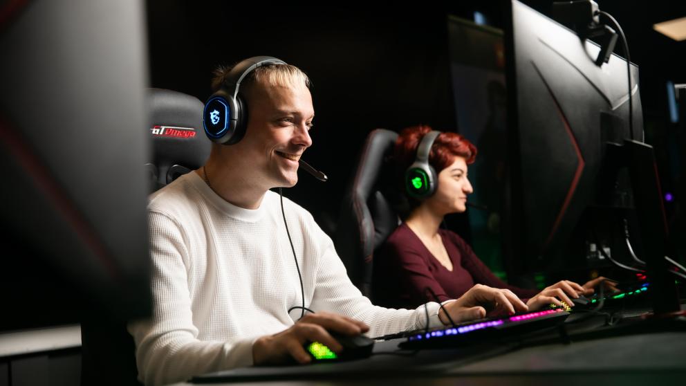 students on PCs in esports lab, salford business school