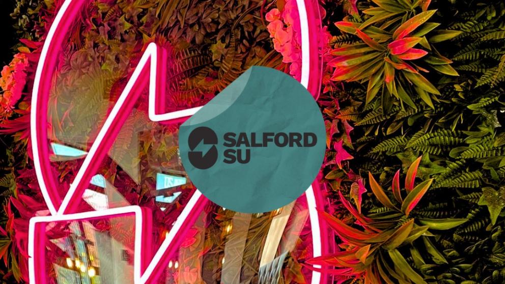 Salford SU logo as a neon sign with an SU sticker