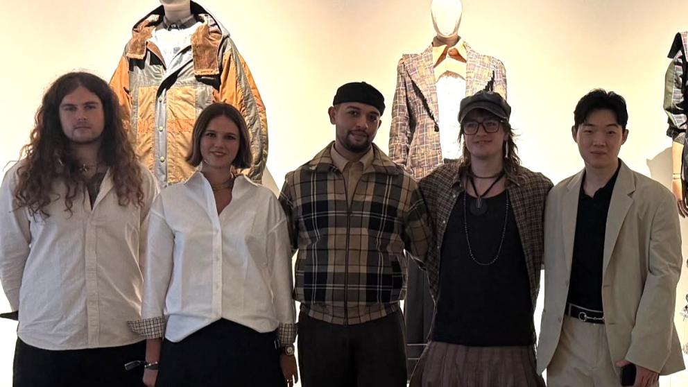A group of University of Salford students in front of their designs at London Fashion Week