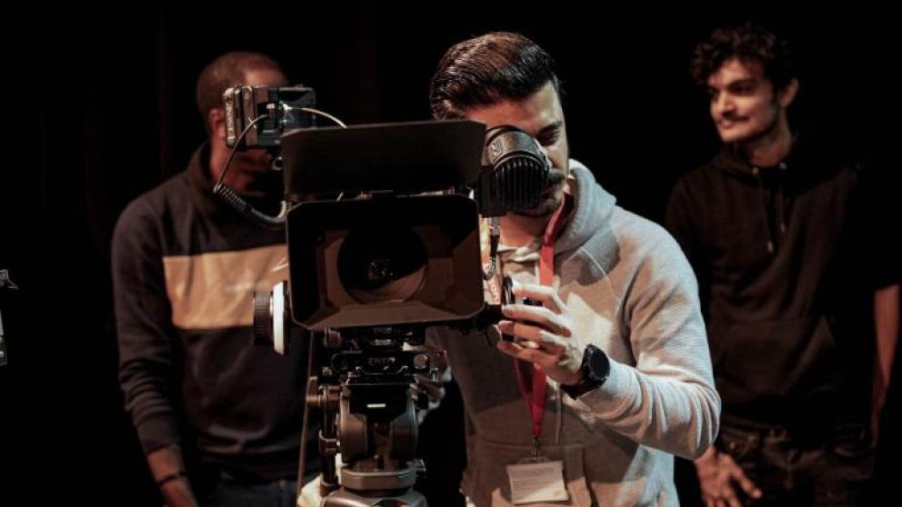 MA Digital Video Production student Muhammad looking through a camera