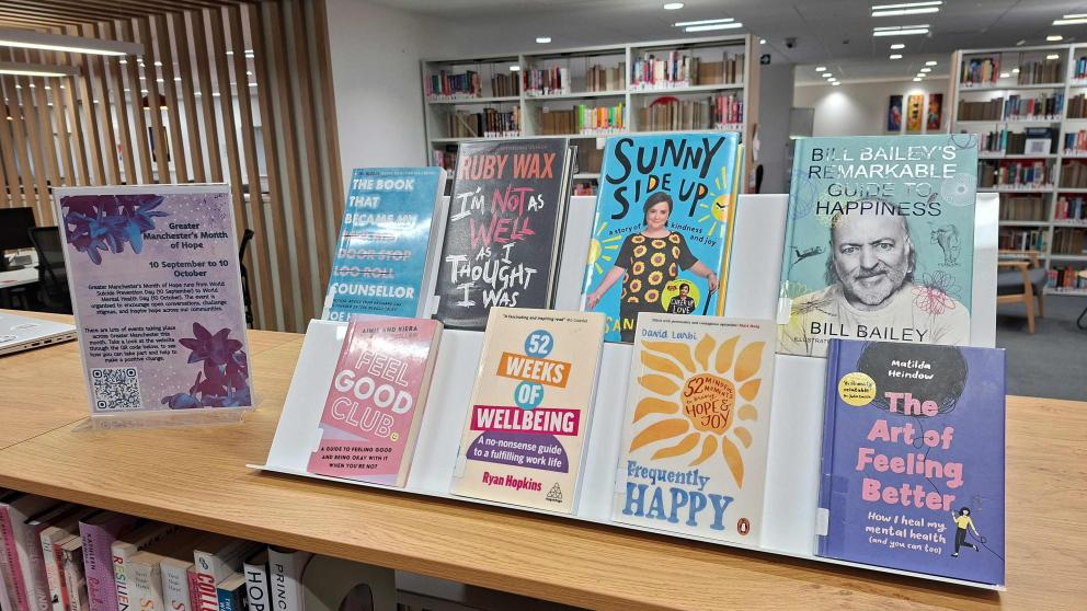Library display for Greater Manchester’s Month of Hope, showcasing a selection of books on mental wellbeing, resilience, happiness and personal development