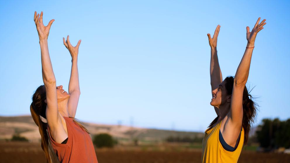 Promo pic for the film shows two women with their hands in the air. "One Day We Will Dance With You"