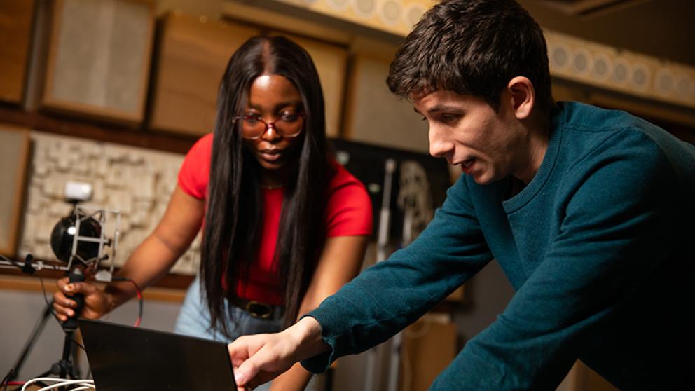 Two students researching in acoustics