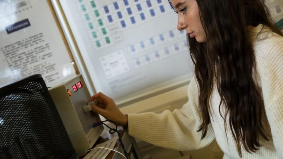 Physics student using lab equipment at the University of Salford