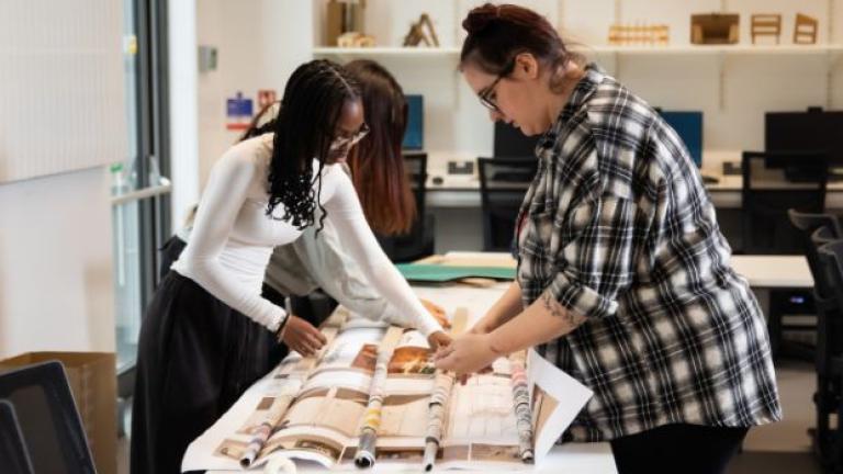 Architecture students working on cardboard models