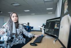 Student looking at imaging results on computer 