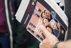 Person holding the University of Salford 2019 prospectus