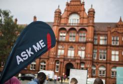 'Ask me' sign in front of the Peel Building, University of Salford