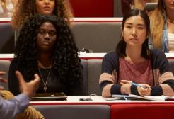 A lecturer presents to a group of students