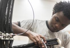 Researcher working on cabling