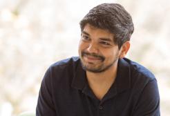 Student reading a book in Chapman Building, University of Salford