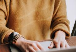 Student typing on a laptop