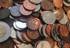 A pile of coins from various countries