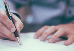 Lawyer at a desk working with pen and paper