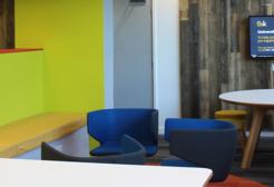 B'Hive collaboration hub with seated area and digital display