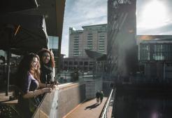Students on a balcony at MediaCity