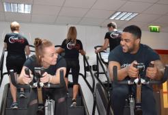 Two people on cycling machines