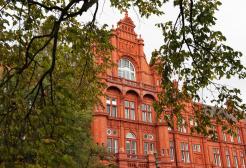 Peel Building through trees in Peel Park, University of Salford