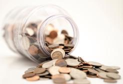 Coins spilling from a jar
