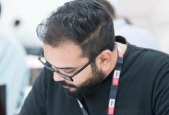 Mature student at desk, writing