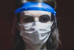 Woman wearing PPE visor