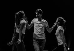 Three actors perform