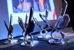 Table holding five alumni achievement awards