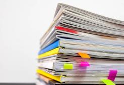 Stack of assorted paper documents