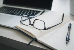 Laptop, book and glasses