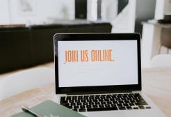 Laptop screen which reads 'join us online' in orange text. 