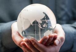 Pair of hands holding a globe