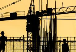 A silhouette of construction workers