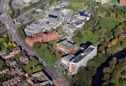 Aerial view of Peel Park campus with buildings and trees