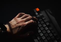 Hand typing on a computer keyboard