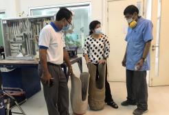 Sisary Kheng with two colleagues