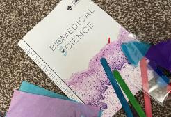 Biomedical Science Day event pack with pin badge, stickers, balloons and leaflets