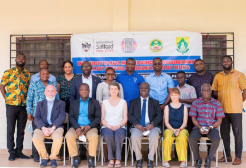 POCUS team sat in front of a banner