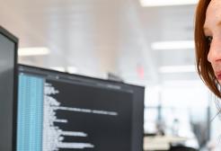 Computer scientist with two monitors