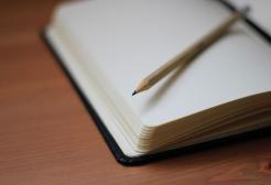 A pencil on a writing pad