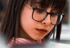 A student looks at books in the Library