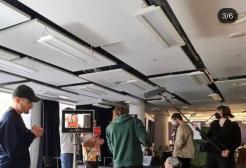 An image showing the film students behind the scenes of their film.