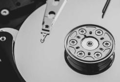 Inside a hard disk drive showing the platter circular discs