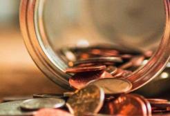 Coins spilling from a jar