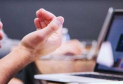 A person works on a laptop