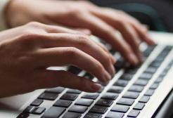 A person uses a laptop