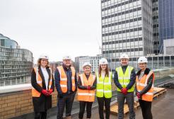 Group of mentors and apprentices wearing high vis