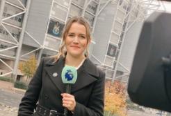 Pien Meulensteen commentating next to a sports stadium