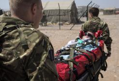 Pictured is a demonstration by an RAF Critical Care Air Support Team, moving a patient.