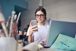 A person works at a laptop