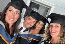 The students in their graduation caps and gowns